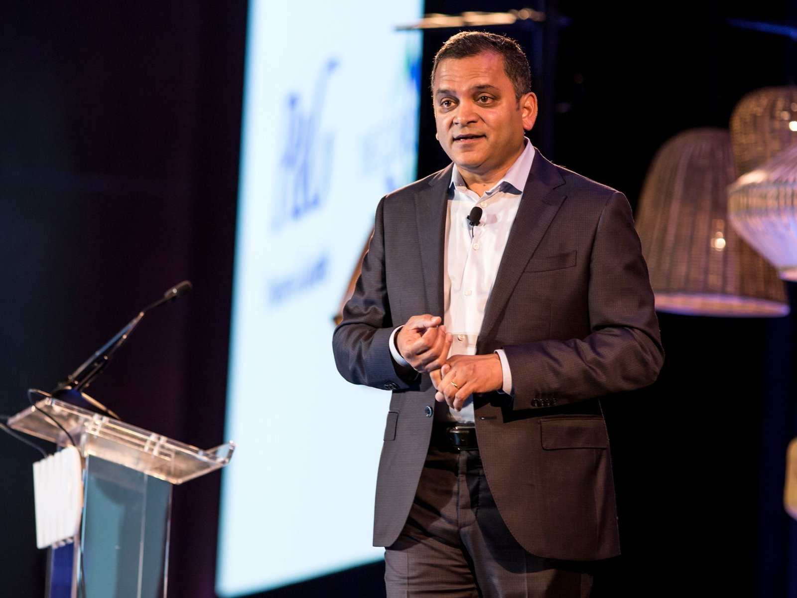 alt="A solitary project manager reviewing complex data architectures on a tablet in an empty modern corporate office"